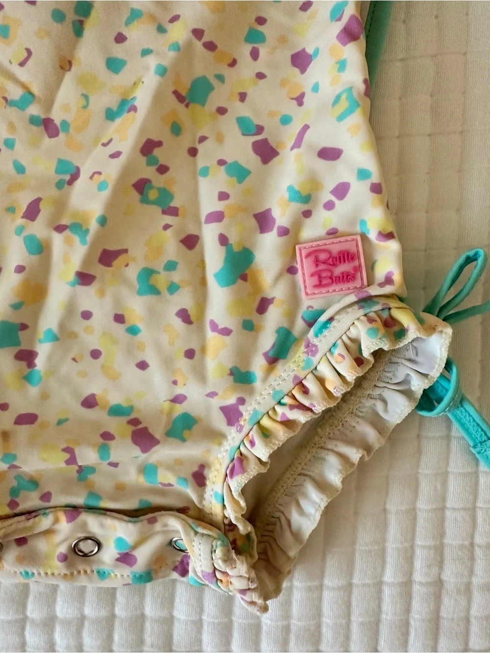 Ruffle Butts Cream Confetti Long Sleeve Rashguard with Teal Hat